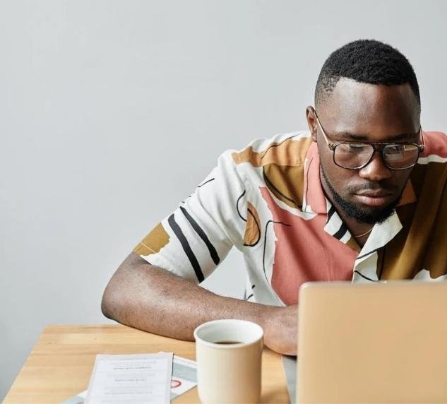 a person who is working on a laptop is writing an article